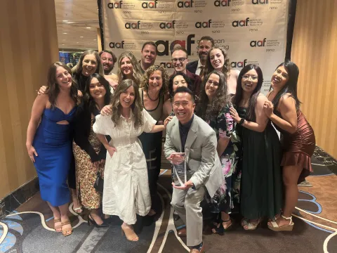 Estipona group team celebrating an award