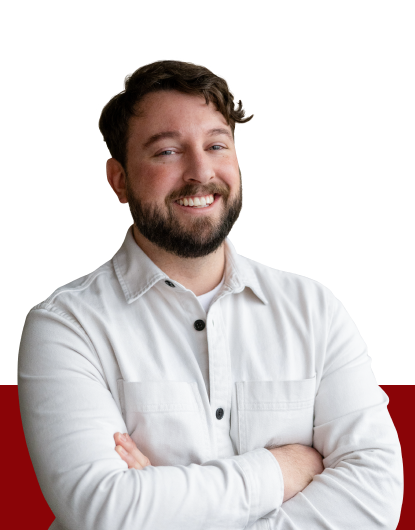 Michael Lindsey from Estipona Group, standing against a red and white background