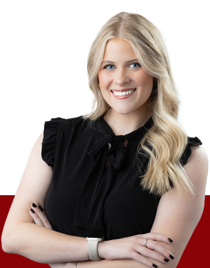 Faith Zinn from Estipona Group wearing a black blouse in front of a white and red background